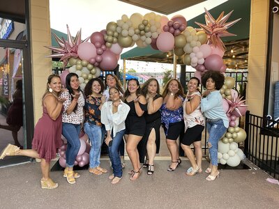 Pink balloon arch for a woman's birthday party by Loononna, LLC in Central Florida.