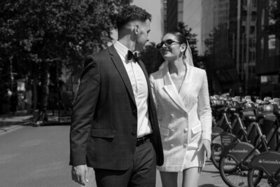 Bride and groom at their intimate London wedding with the London bridge behind them