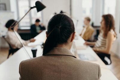 Woman leading a group from a values-based place.