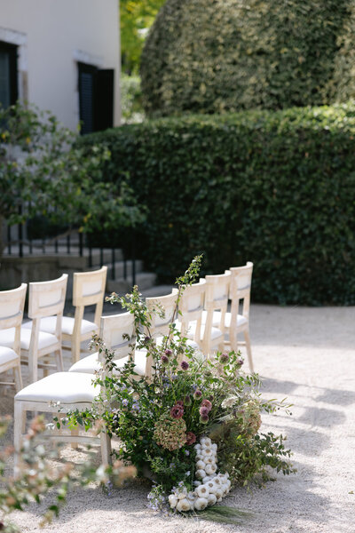 Northern California Wedding Photographer capturing an intimate outdoor ceremony setup with lush floral arrangements and soft natural light.