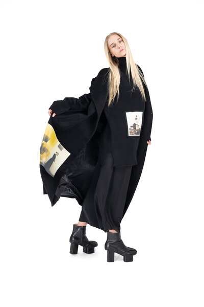 model with long overcoat posing for catalogue