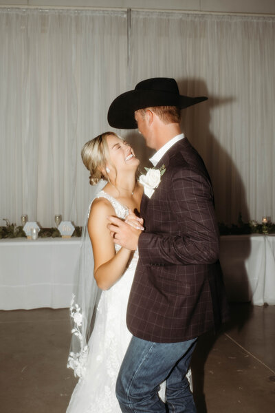 bride and groom dancing together at their wedding reception in Oklahoma