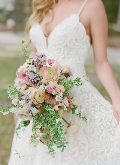 Spring bridal bouquet with sweet pea, ranunculuas and fritillaria