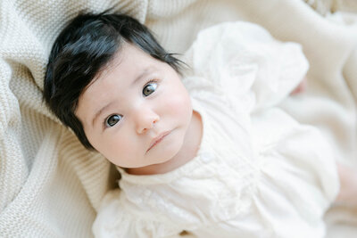 baby girl with big brown eyes