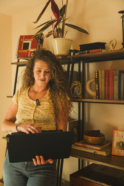 Web Designer standing in bold office, crafting a brand 