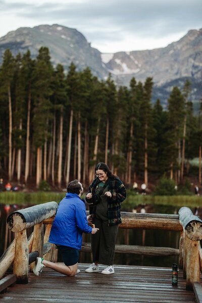 proposal with the mountains in the background colorado