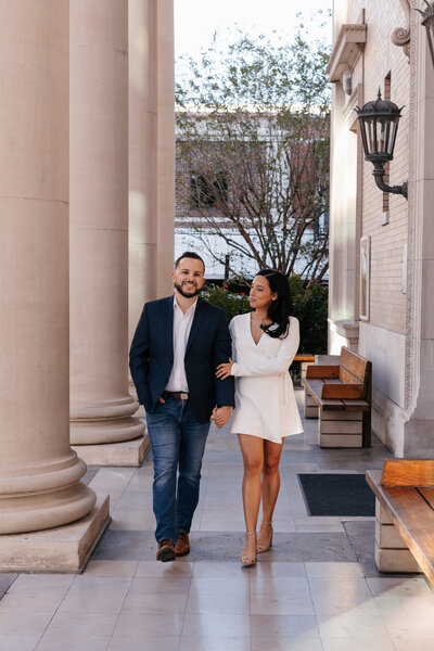 Couple eating pizza in downtown Gainesville for their engagement photos with Indie West Photo