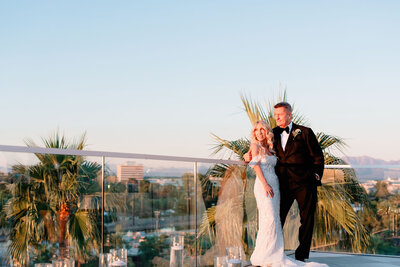 Bride and groom watching sunset together after getting married at hotel valley ho.
