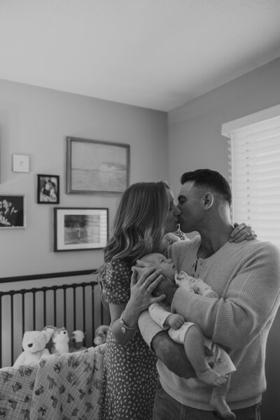 in home newborn family lifestyle session in comfort of own home. nursery photos with family. black and white photos that are candid