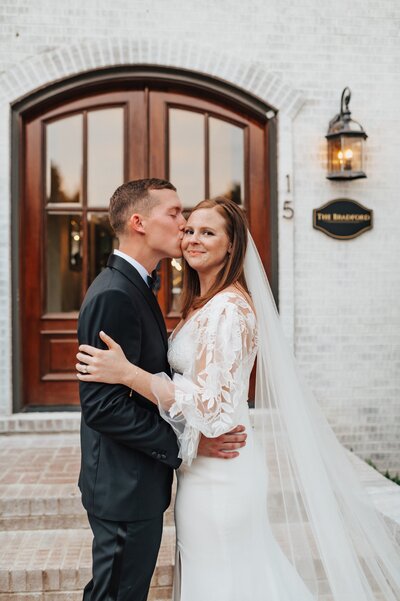 Bride and groom outside of their North Carolina wedding venue