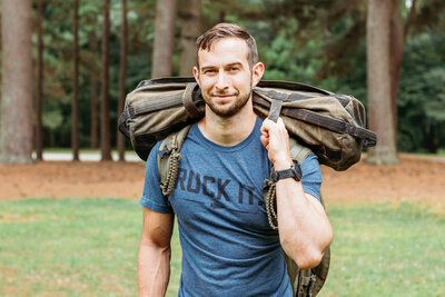 Joe Baker of Joe Baker Fitness with ruck bag, leader in ruck training and endurance coaching.