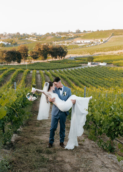 A happily married couple enjoying a moment at their wedding venue in Temecula, California