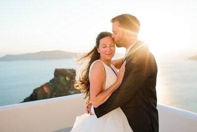 Utah Wedding Photographer captures mountain wedding with bride and groom embracing at golden hour