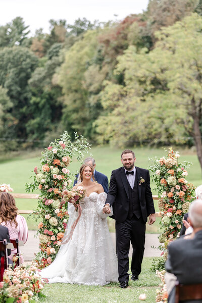 Bride and groom walk up memorial steps at their DC wedding