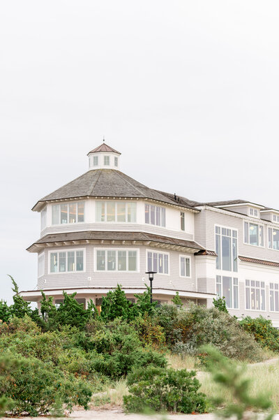 A stunning view of Dune at Wychmere Beach Club in Harwich Port, Massachusetts. This luxury Cape Cod wedding venue offers panoramic ocean views and timeless coastal charm for an unforgettable celebration.