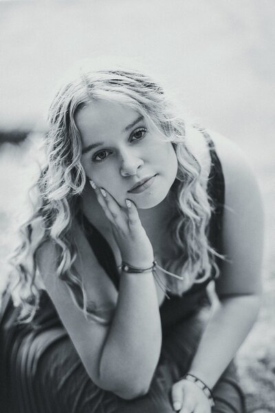 Black & White photo of girl with hand on her face | Senior Session