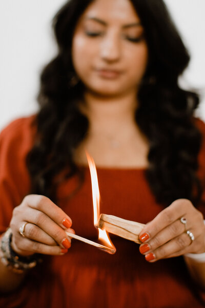 Mindfulness coach Radhika burning herbs