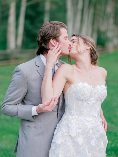 Bride and groom kiss, photographed by Aspen Wedding Photographers Sarah Nann