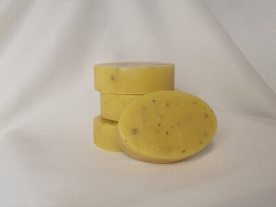 Handmade honey Rose Oatmeal soap stacked together to display rose petals
