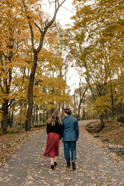 couple walking through the woods