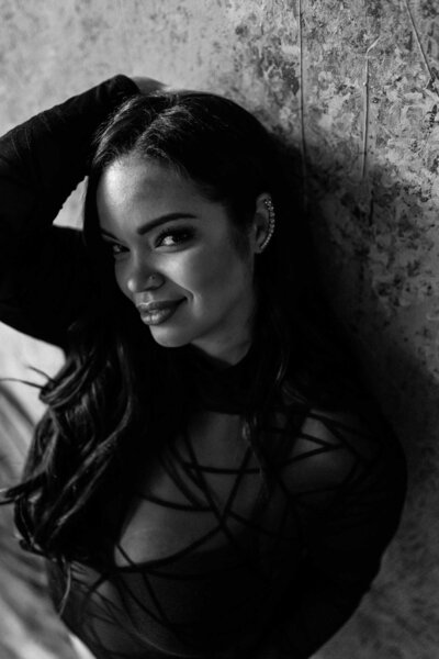 black and white photo of a woman smiling