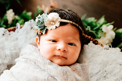 Newborn photography image of baby girl with flower headband