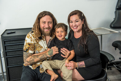 Axiom Tattoo shop owners Travis and Priscilla Luckhurst with their son