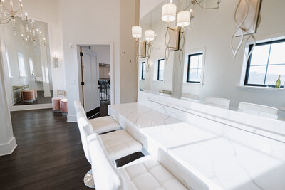 Bridal suite with crystal chandelier and mauve velvet seating