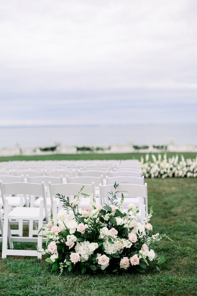 seaside ceremony flowers at rosecliff mansion