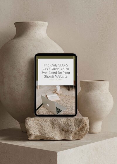 iPad sitting on a rock in front of a stone vase, showcasing SEO freebie PDF by Unica Formo.