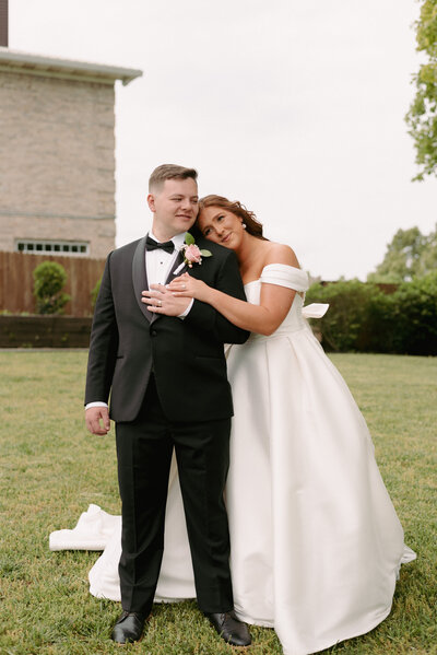 A bride and groom have a dance outside of their churh