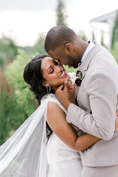 Bride and groom touching noses