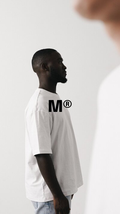 Logo design overlaid on black model for Miami model agency