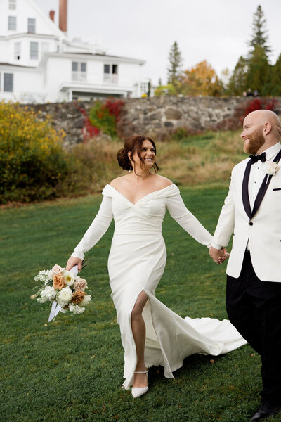 Bride and Groom walking together at their intimate wedding at the Blair Hill Inn at Moosehead Lake in Maine