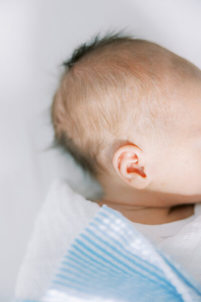 close up photo of newborn baby boy's ear