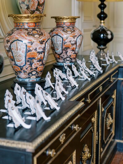 table placement cards sitting on black dresser