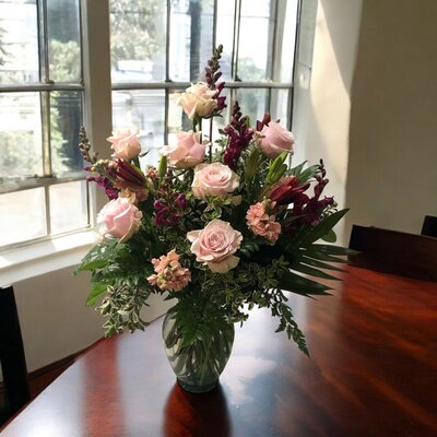 side arrangement funeral flowers at White Pine funeral Home