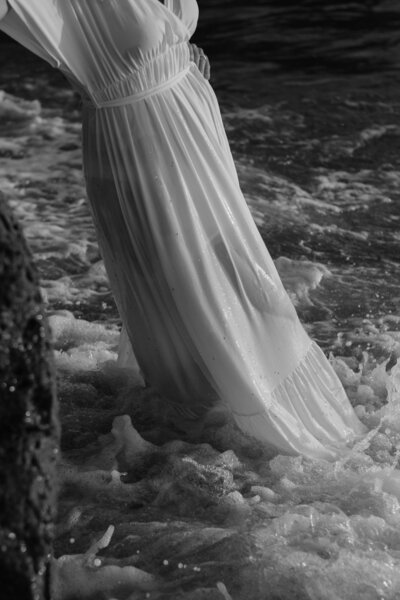 woman's dress in ocean waves