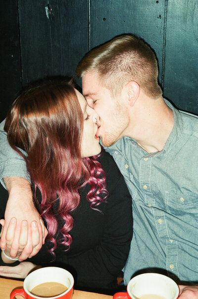 film portrait of a couple making out