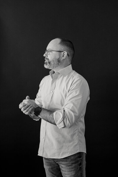 josh hester, founder, in jeans and a white button-down shirt