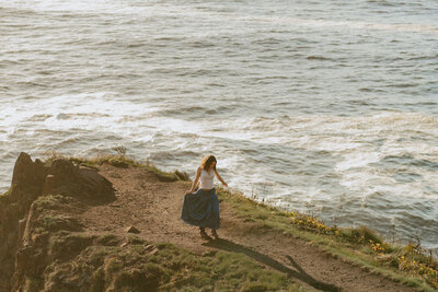 girl running on cannon beach