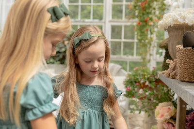 young sisters explore in beautiful greenhouse at Rustic Wild Arrow in brooklyn michigan