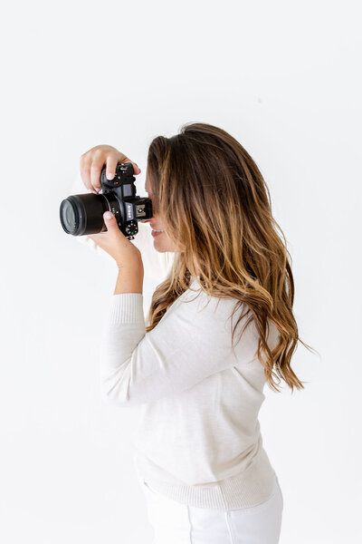 Jackie holding camera