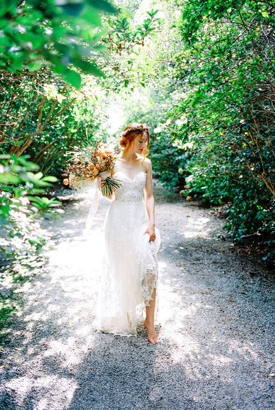 Woodland bridal portrait with a timeless wedding dress, dyed flower crown and organic bouquet