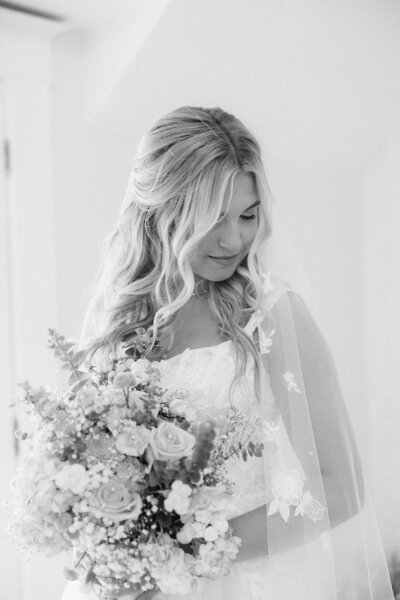 A bride looking over her shoulder.