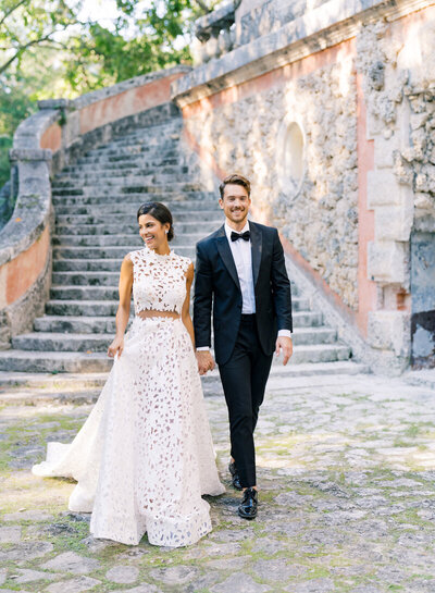 Bride and groom walking at museum garden wedding
