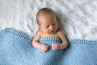 Little Braven is such a sweetie.  Those  chubby cheeks help make his lifestyle newborn photography session one of our favorites.