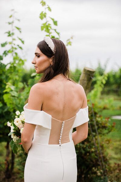 dress detail of bride from behind in vineyard