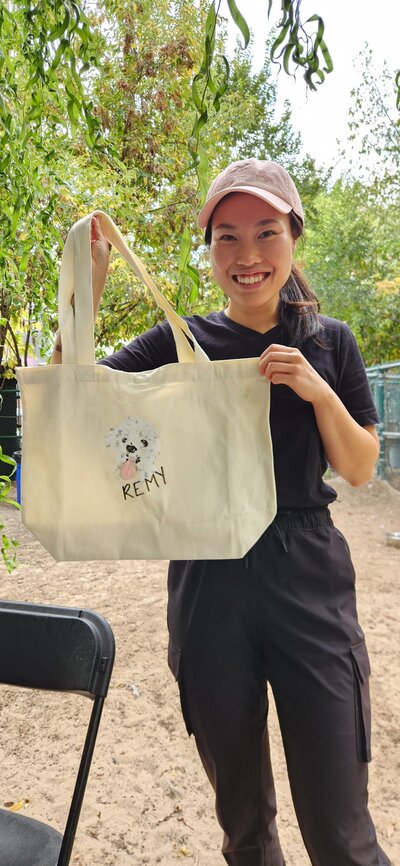 Custom hand-painted tote bag featuring a pet dog portrait by Toronto illustrator Jenny Zhang