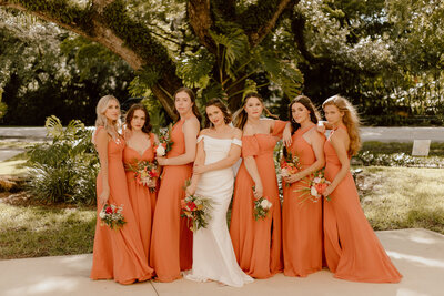 bride and bridesmaids during outdoor wedding party photos